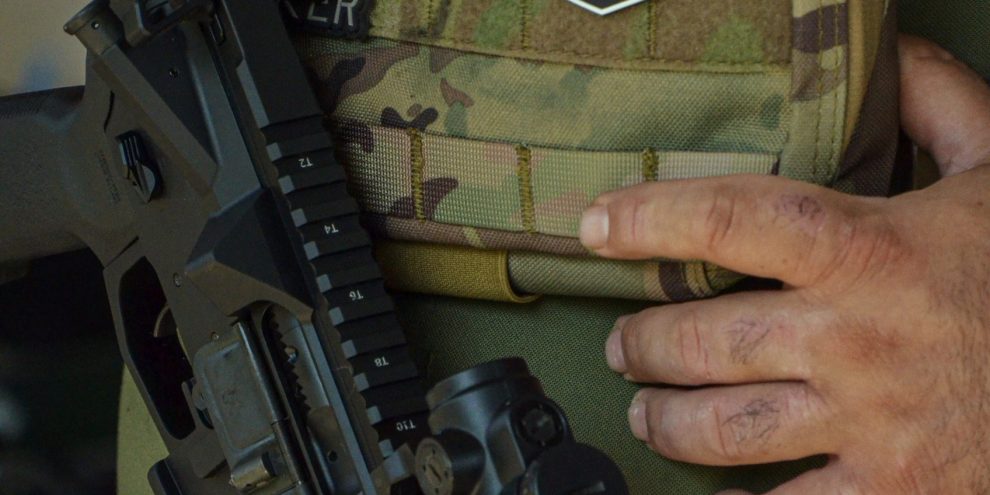 anodized vs cerakote rifle shown with body armour