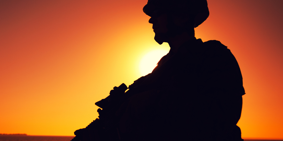 military sillhouette soldier in a sunset