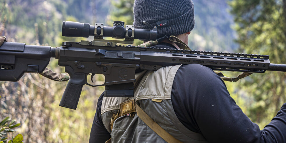 Savage Bear Hunt_Edit_19 Caleb with mitchell defense rifle